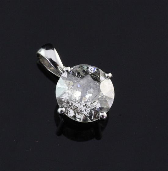 An 18ct gold and solitaire diamond pendant, 0.5in.